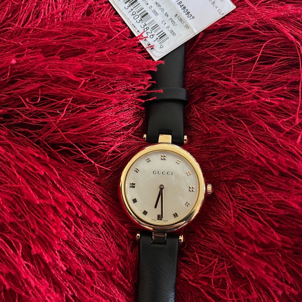 Women’s black Gucci watch